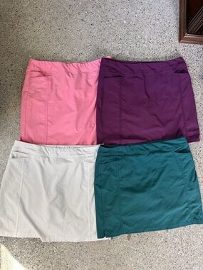adidas Four-Pack golf Skirts in Pink, Purple, white and Teal